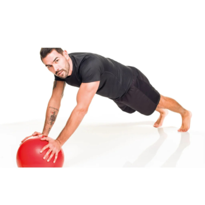 Man in black athletic wear in a push-up position with hands on a red stability ball on a white studio floor.
