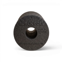 Round black Blackroll tool with a central hollow hole and embossed branding (made in Germany).